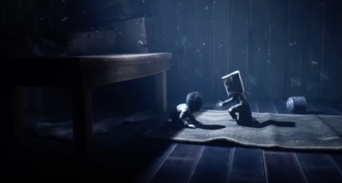 Cena do jogo Little Nightmares 2 em um ambiente escuro e misterioso, com iluminação suave e atmosfera de suspense. Um dos jogos indie mais reconhecidos.