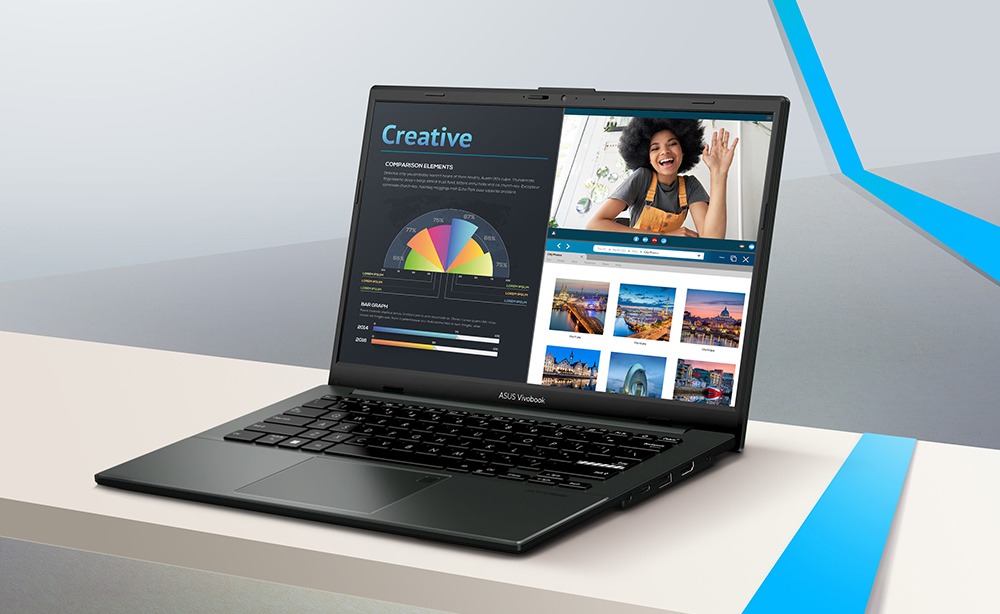 Notebook ASUS Vivobook GO aberto em cima de uma mesa exibindo na tela gráficos com a palavra Creative, uma videochamada e uma galeria de fotos.